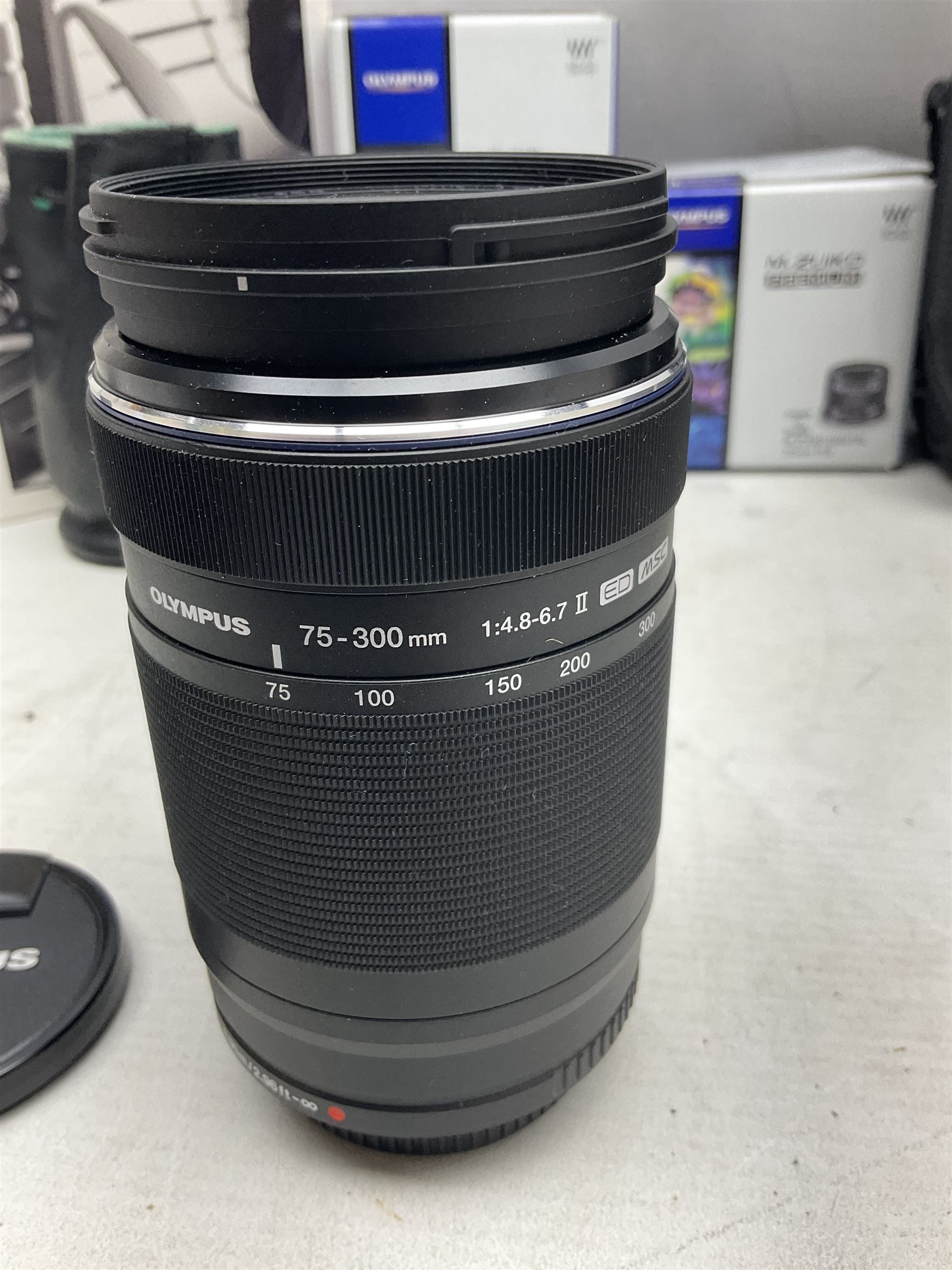 Olympus PEN-F camera body, with 'Olympus M- Zuiko Digital 25mm 1: 1.8' lens,  'Olympus M- Zuiko Digital 75-300mm 1: 4.8 - 6.7' lens and  'Olympus M- Zuiko Digital 17mm 1: 1.8' lens, with original box, together with Lowepro camera bag