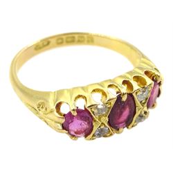 Early 20th century 18ct gold pink three stone ring, with four diamond accents set between, Birmingham 1918