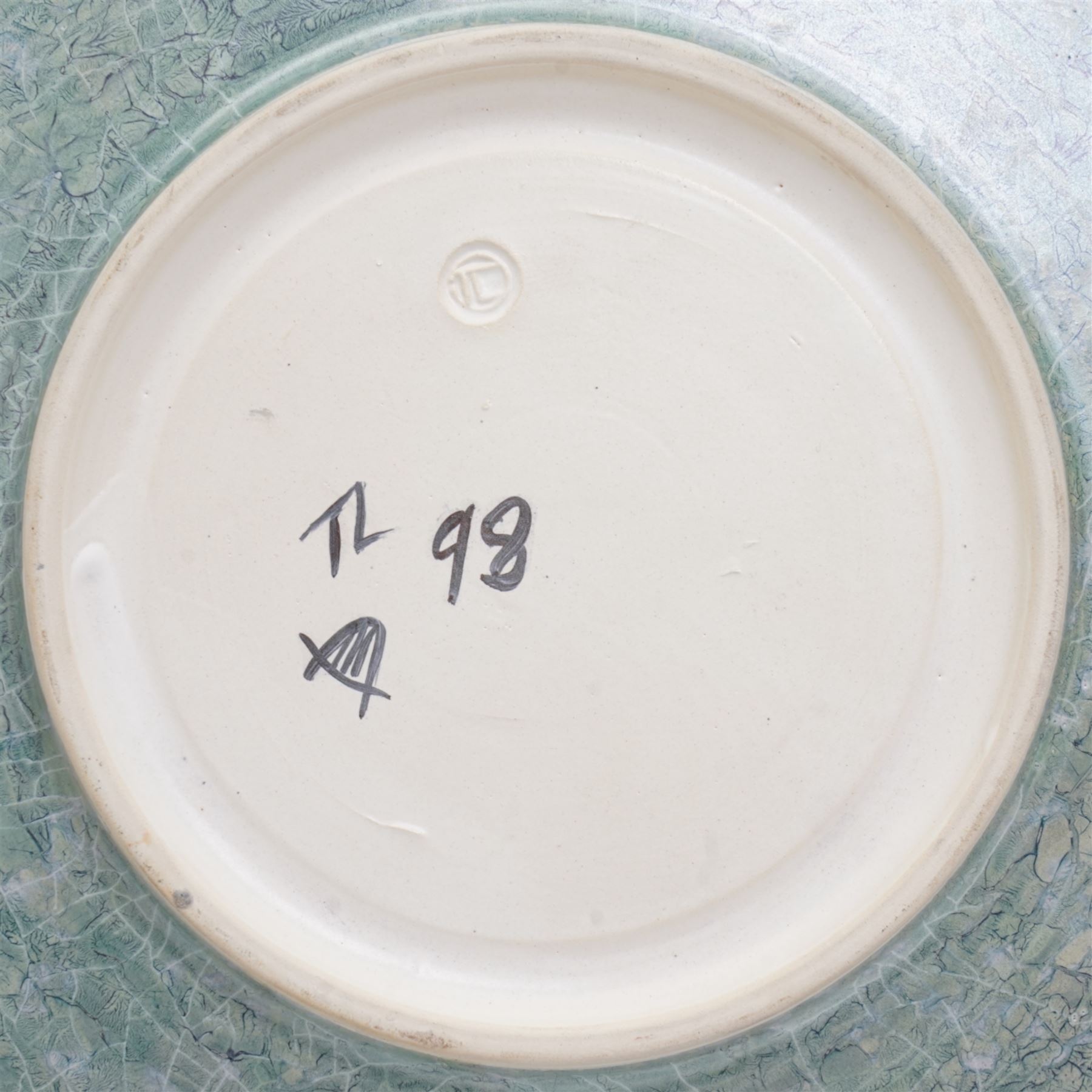 Tony Laverick (1961-); Charger painted with crossing horizontal and vertical lines of marbled blue and orange, the base signed with initials and dated '98, D42.5cm and a smaller bowl, signed with initials and dated '99, D26cm (2)