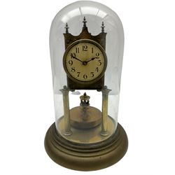 An anonymous early 20th century German 400-day torsion clock, with a circular enamel dial, upright Arabic numerals and minute track, spade hands under a glass shade, circular rotating pendulum with regulation, on a circular brass base with adjustable feet. 
H33cm
