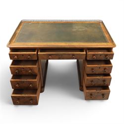Victorian figured walnut twin pedestal desk, brass galleried top with inset tooled green leather writing surface, above three frieze drawers, raised on two pedestals with three drawers, on plinth bases above castors