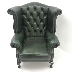 Queen Anne style wing back armchair upholstered in deep buttoned green leather, cabriole legs, W92cm