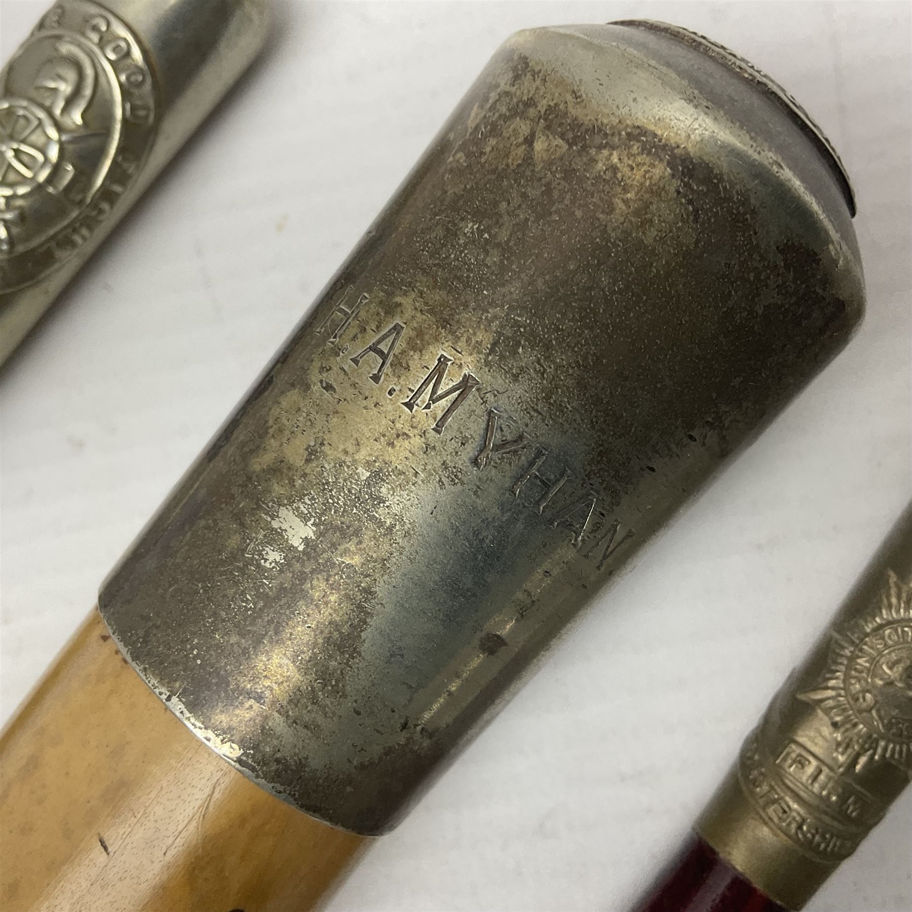 Three parade ground canes - malacca cane Coldstream Guards with plated mount engraved 'H.A. Myhan' L87cm; ebonised Church Lads Brigade 'Fight The Good Fight'; and mahogany stained Worcestershire Regiment (3)