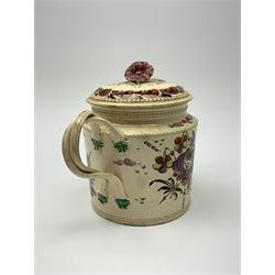 18th century creamware teapot, probably Leeds, with reeded entwined handle and floral finial to the cover, the body with hand painted polychrome decoration of figure to one side, and floral spray to the other, collectors paper label beneath inscribed Leeds Pottery, H11.5cm