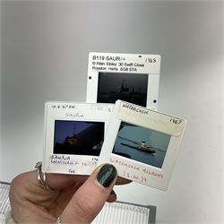 Over one thousand four hundred and fifty annotated and dated photographic slides of worldwide shipping and maritime interest including warships, naval and merchant vessels 1950s - 2000s contained in twenty-five matching plastic slide boxes, each with index to the top