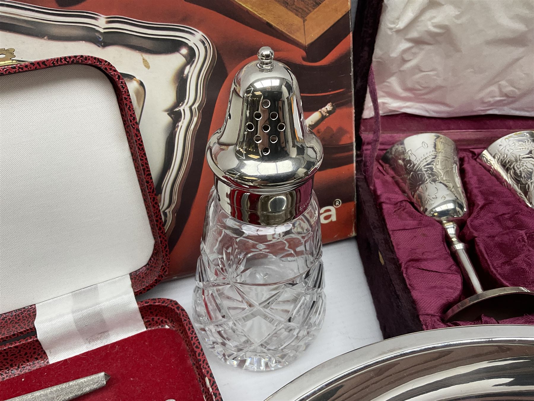 Silver plated Calibri lighter, in the form of a twin handled vase with mask handles, together with a pair of silver plated candle sticks, horn handled carving set with hallmarked silver ferrules and other silver plated items