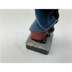 Robinson Jam plaster Golly band, including drummer and singer, H7.5cm

Originally handmade by mothers in Africa for their children from old fabric and cloth, the golly doll was adopted as the mascot and trademark for the Robertson's confectionery brand around 1910 after the company's founder John Robertson visited the US and noticed children playing with them. Robertson's Gollies have been collected by people across the UK and around the world for generations but garnered a contentious image in the 1980s because of links to racism. The trademark was removed from Robertson's branding in 2001.