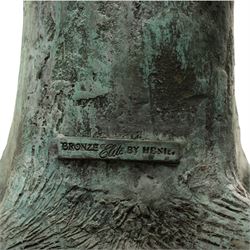 After Eneri Prosperi, bronze garden letterbox, modelled as a seated boy reading on a tree stump, with rustic post box with mail indicator, dog at his feet, textured verdigris finish throughout