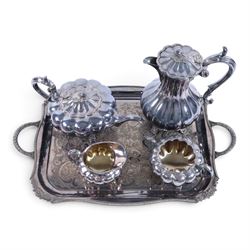 Early 20th century silver plated four piece melon-shaped tea service by James Dixon & Son Sheffield, comprising teapot, hot water jug, milk jug and open sucrier, together with a silver plated twin handled tray with engraved floral decoration