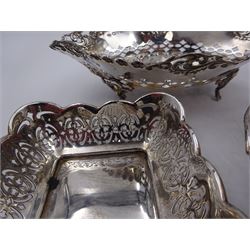 Three pierced silver bon bon dishes, including navette shaped example upon four pad feel, all hallmarked, together with a 1920s silver mounted manicure set, hallmarked G & C Ltd, Birmingham 1925, in fitted case 
