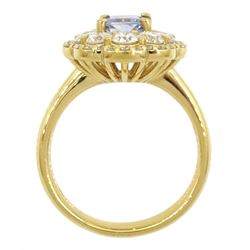 18ct gold radiant cut Ceylon sapphire and round brilliant cut diamond cluster ring, hallmarked, sapphire approx 1.20 carat, total diamond weight approx 1.40 carat