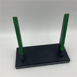 Polished ammonite plate, formed of individual ammonites age; Jurassic period, upon an ebonised stand, D27cm