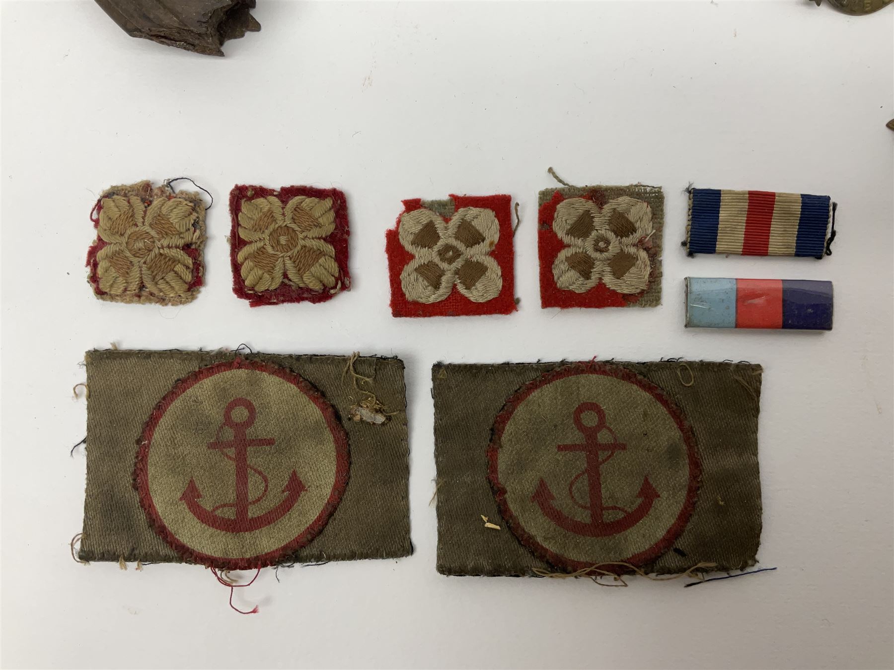 WW2 German Luftwaffe Mess cutlery comprising table spoon and fork, each with H.M.Z.38 mark; WW1 British War Medal awarded to L-13858 Gnr. J. McCabe R.A.; and small quantity of military badges, rank pips etc