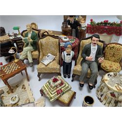 Dolls house living room and dining room furniture, including arm chairs, desk, fireplaces, dressers, tables, eight figures and a large collection of predominantly Christmas themed food, accessories and decorations