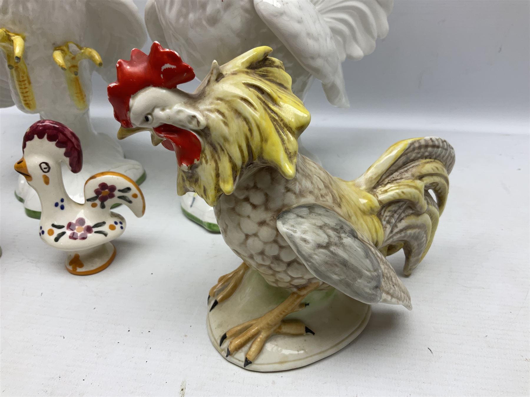 Pair of fighting cockerels from Italy together with three other ceramic cockerels, largest H30cm 