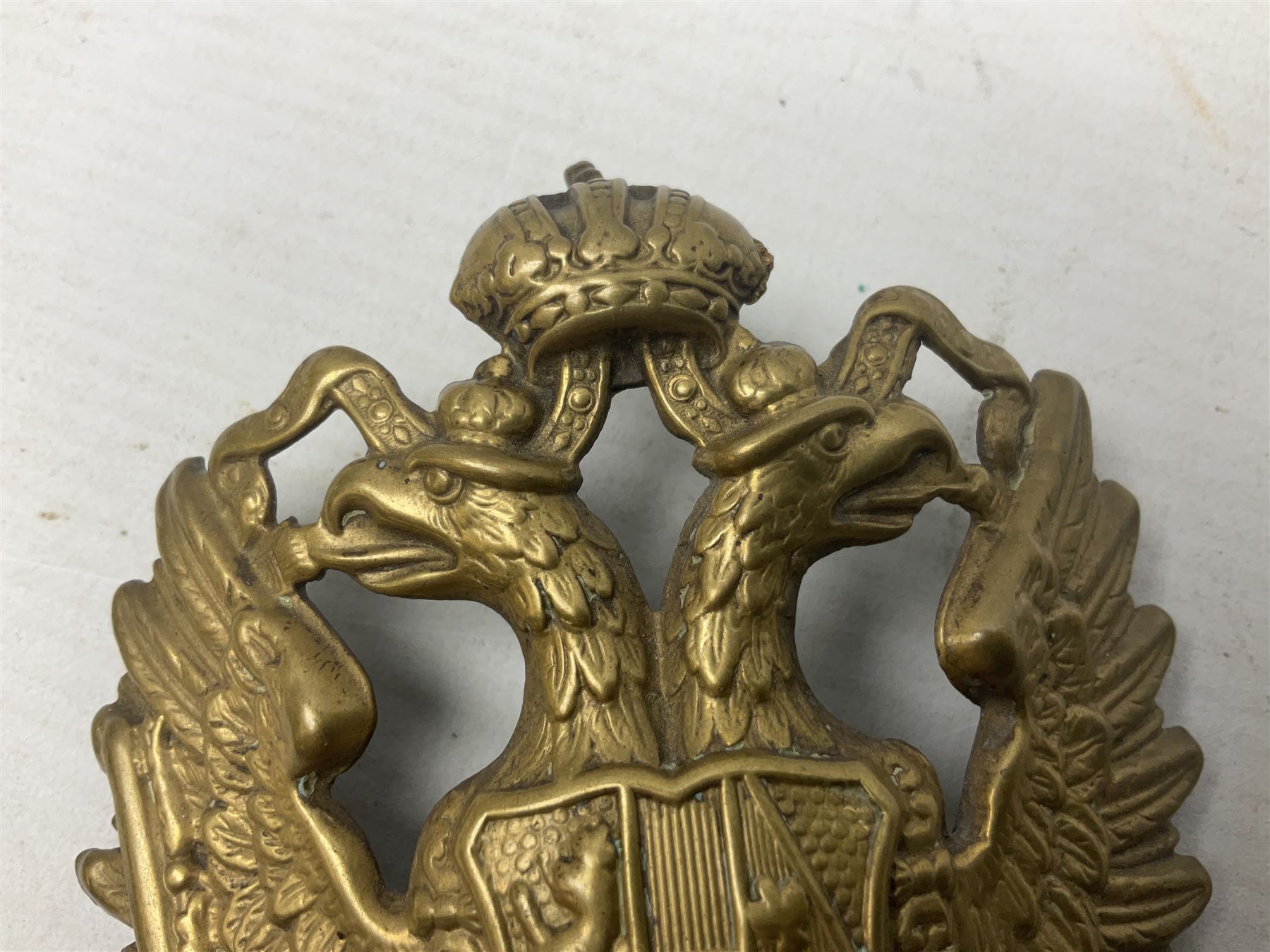 Austrian shako plate 1890 - 1914 with three fixing eyes verso