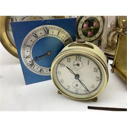 An assortment of 400-day torsion clocks for repair or spare parts.