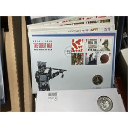 Approximately one hundred and fifteen Royal Mint coin covers, in two ring binder folders and loose, together with approximately 53 grams of Great British pre-1920 and approximately 68 grams of Great British pre-1947 silver threepence coins, and a small quantity of further pre-decimal coins