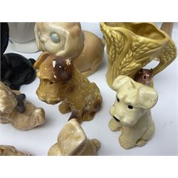 Collection of Sylvac and similar animal figures, including rabbits, hares and dogs, together with Falcon budgie vase, etc 