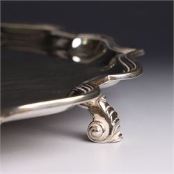 Mid 20th century silver tray, with shaped rim and upon three scroll feet, William Suckling Ltd, Birmingham 1946, D36cm