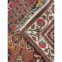 Belgian Sultan woollen ground rug, central navy field densely decorated with floral sprays and geometric patterns (192cm x 135cm); handwoven tribal terracotta ground rug (121cm x 71cm); Persian crimson ground runner, all over stylised floral and foliate motifs (266cm x 94cm)