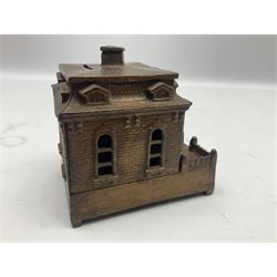 Late 19th century mechanical cast-iron money bank as a dog on a turntable revolving in and out of a  building c1882 by Judd Manufacturing Company L13.5cm