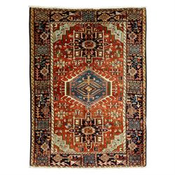 North West Persian Karajeh hand-knotted rug, terracotta ground, with a stepped geometric p...