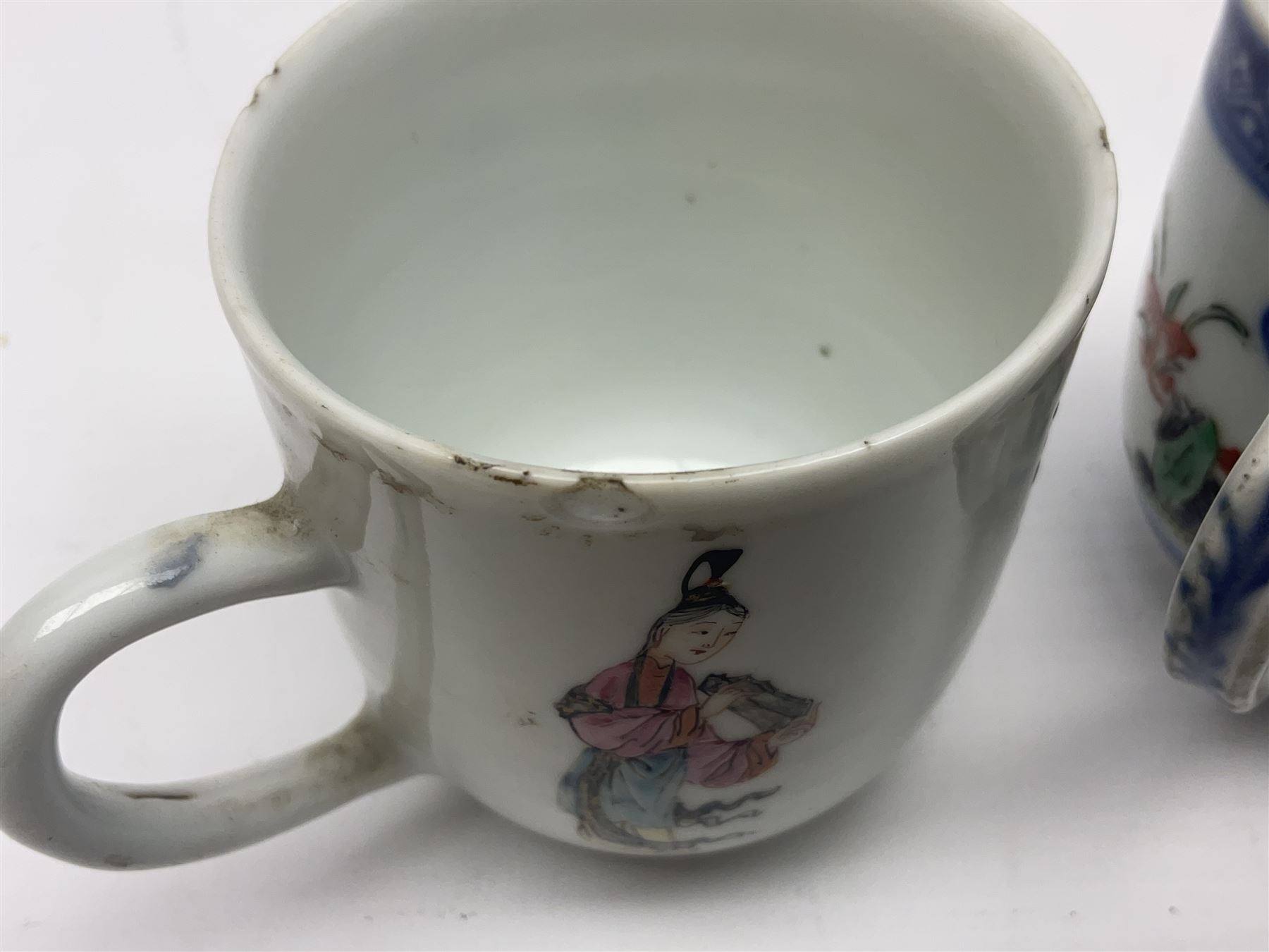 Two 18th century Chinese Yongzheng coffee cups, the first example decorated in polychrome enamel with rooster amidst blossoming peonies, the second decorated with deer and crane among rockwork and pine tree, together with two further 18th century Chinese coffee cups, an 18th century Chinese tea bowl, and a further tea bowl