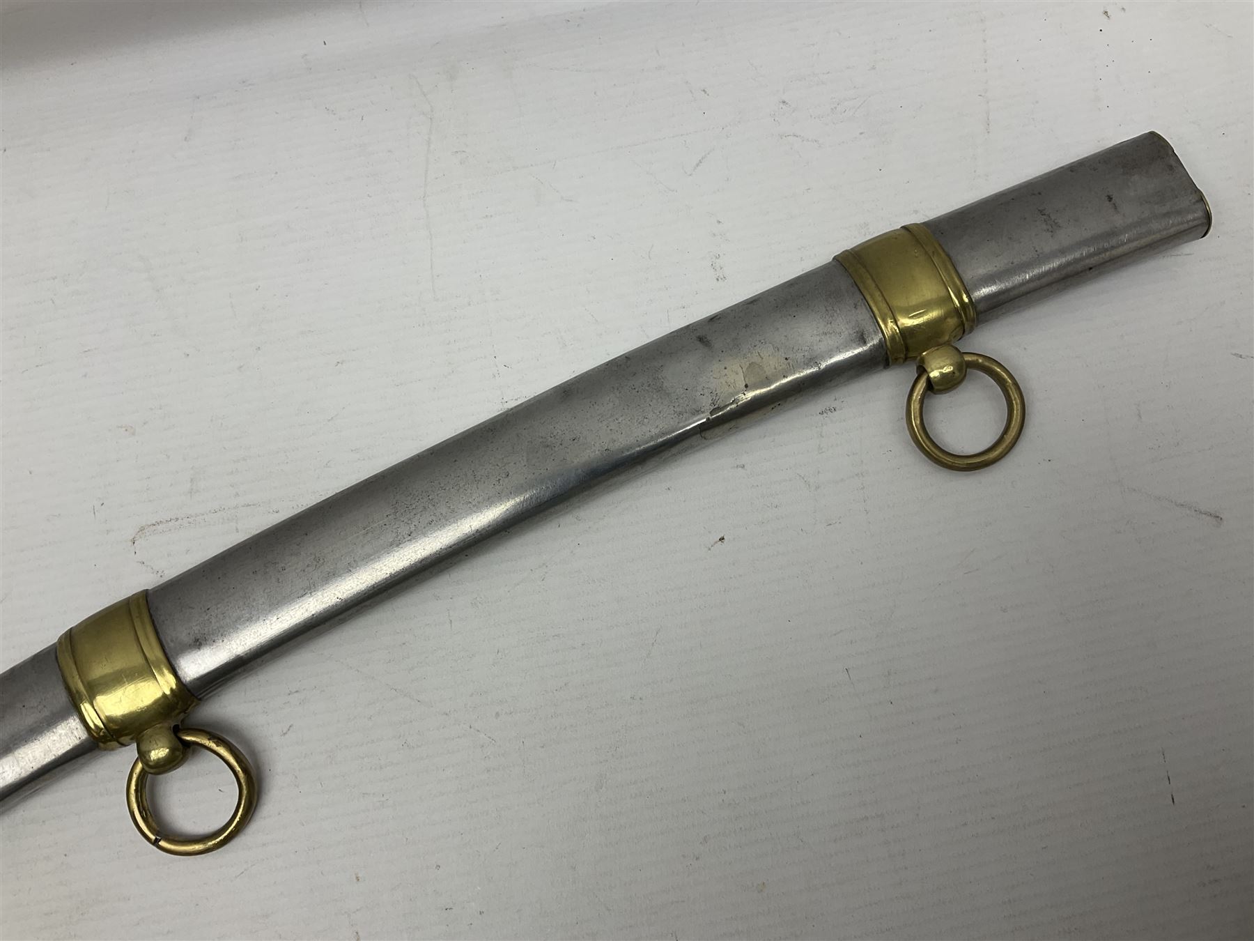 Early 19th century French Lancers officer's sword c1810, the 84cm curving fullered blade retaining most of its bluing, gilding and engraved decoration, inscribed I.S.& C. to ricasso (for Schimelbusch), brass three-bar hilt with elongated elliptical langets and wire-bound leather grip; in polished steel scabbard with two brass suspension rings L100cm overall