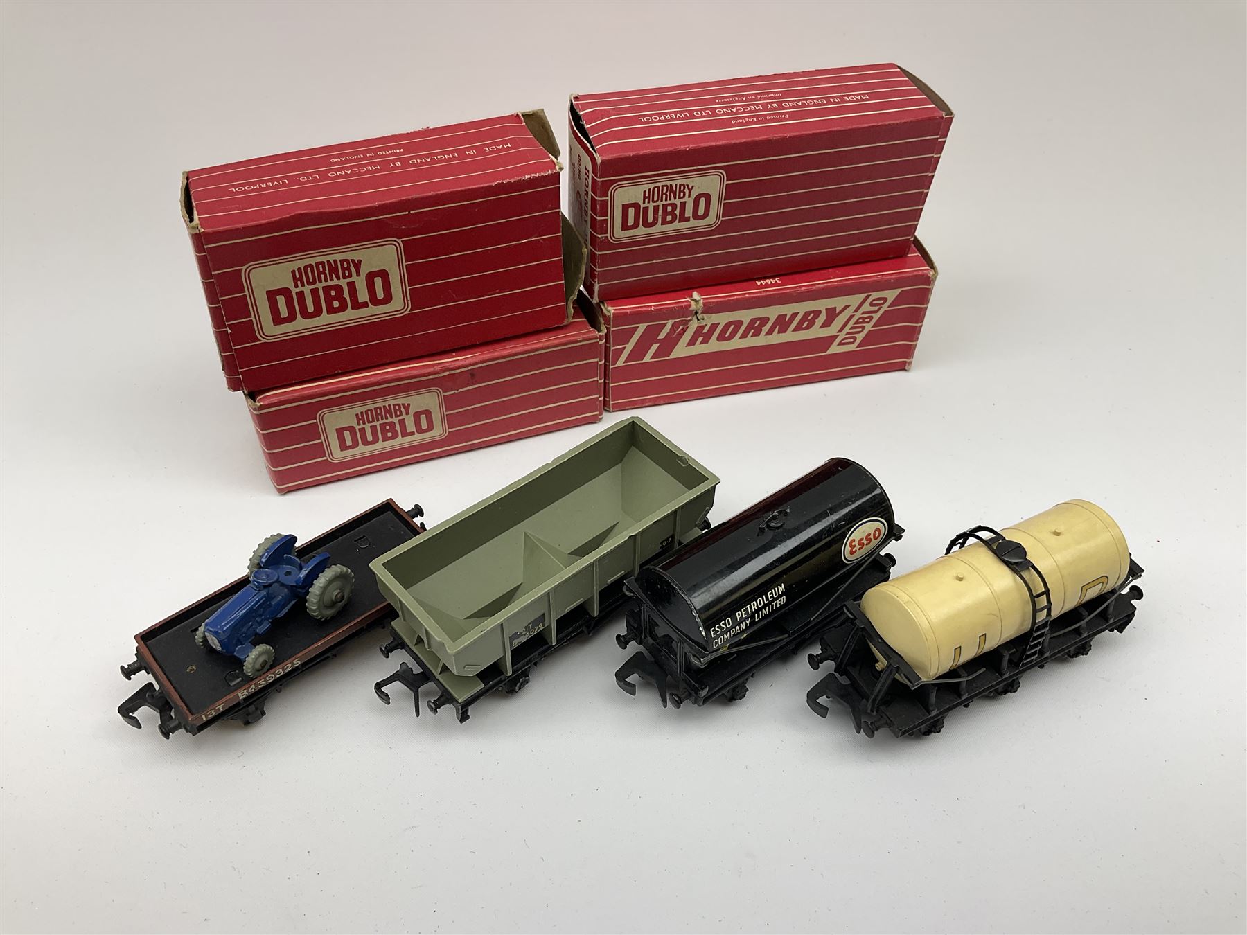 Hornby Dublo - 4644 21-Ton Hopper Wagon;4649 Low-Sided Wagon with tractor; 4680 Tank Wagon 'Esso' (Fuel Oil); and 4657 'United Dairies' Milk Tank Wagon; all boxed (4)