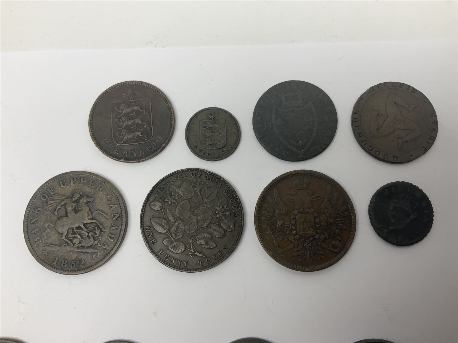 Thirty six late 18th century and onwards United Kingdom and World coins and tokens, to include 1772 Catherine II 5 Kopecks, Swedish quarter and half Skilling pieces dated 1809 and 1806, two Skilling Courant piece dated 1810, 1831 Isle of Man half penny token etc 
