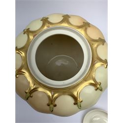 A Royal Worcester blush ivory potpourri jar and cover, of lobed form decorated with floral sprays and heightened with gilt, with printed marks beneath, RdNo112589, shape 1312, overall H19.5cm.