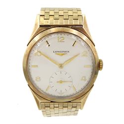 Longines gentleman's 9ct gold manual wind wristwatch, Cal. 12.68Z, silvered dial with subsidiary seconds dial, on 9ct gold gold strap, both London 1957