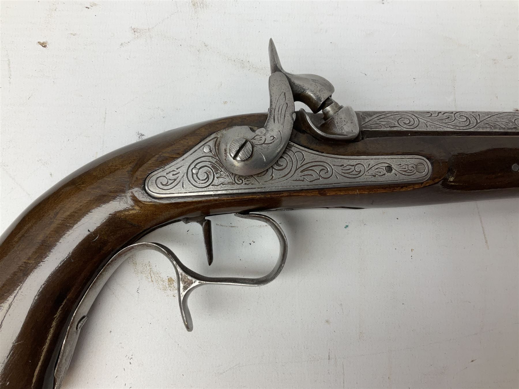 SECTION 1 FIREARMS CERTIFICATE REQUIRED OR REGISTERED FIREARMS DEALER - Pair of Reproduction Continental .44 calibre percussion target pistols, each with heavy 23.5cm octagonal to round barrel bearing various marks, crude scroll engraving to lock plate, hammer and octagonal section of barrel, unchequered walnut stock with brass butt plate and steel hooked trigger guard, numbered 8138 & 8164, L41.5cm overall; in maroon baize lined converted sapele mahogany fitted case bearing reproduction trade label for Trulock & Son Dublin containing small copper powder flask, steel scissor action bullet mould, nipple key, turned wooden mallet and lidded box, steel rammer and wooden cleaning rod, case L48cm