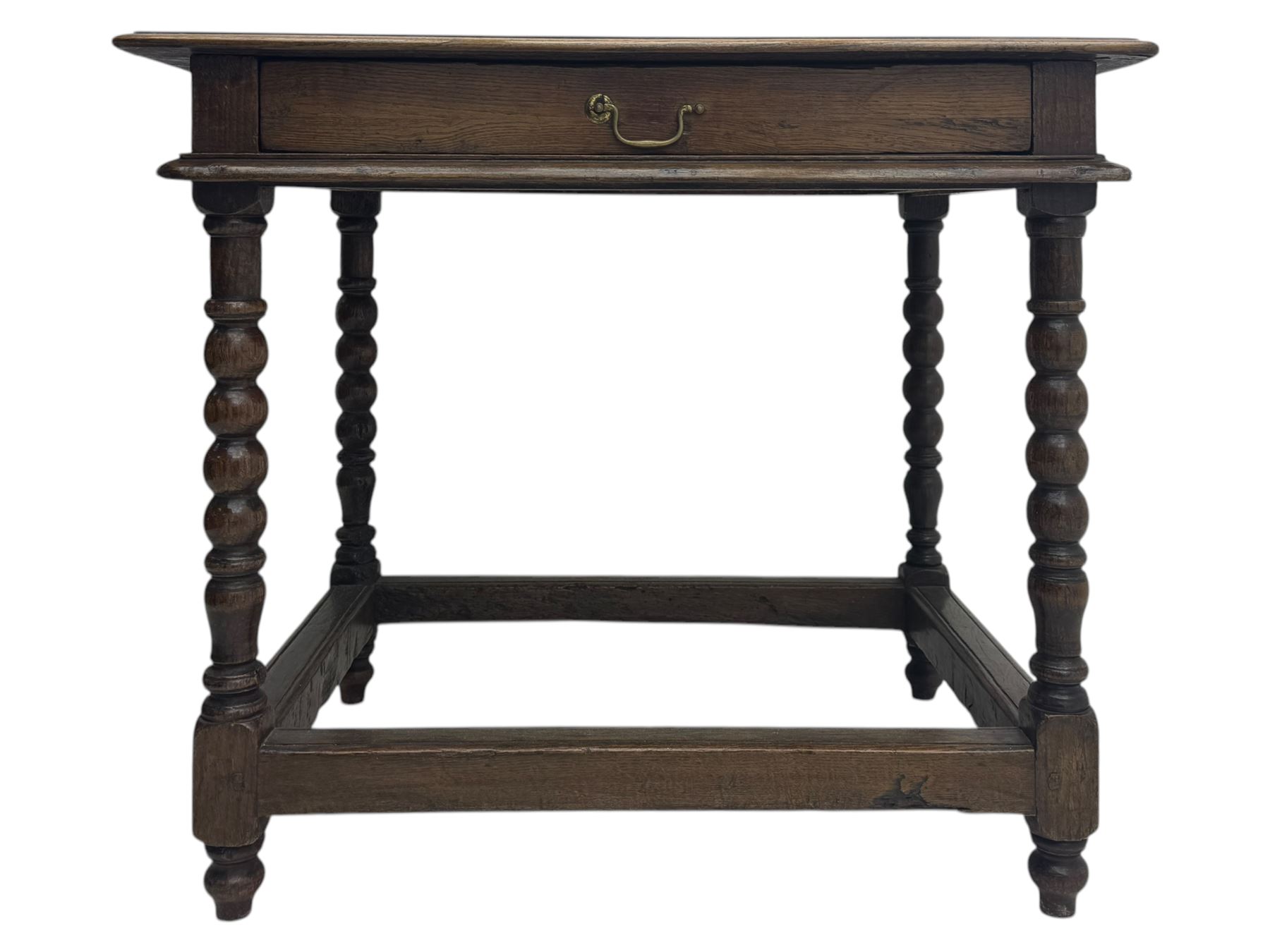 Late Victorian oak side table, rectangular top with moulded edge and frieze drawer with brass handle, raised on turned bulbous supports united by square-section stretchers