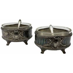 Two Georgian silver toddy ladles with baleen twist handles, (neither hallmarked), one with inset coin to bowl, together with a group of silver plate including cruet stand enclosing two glass bottles with stoppers, shaker and preserve pot with spoon, pair open salts with glass liners, etc. 