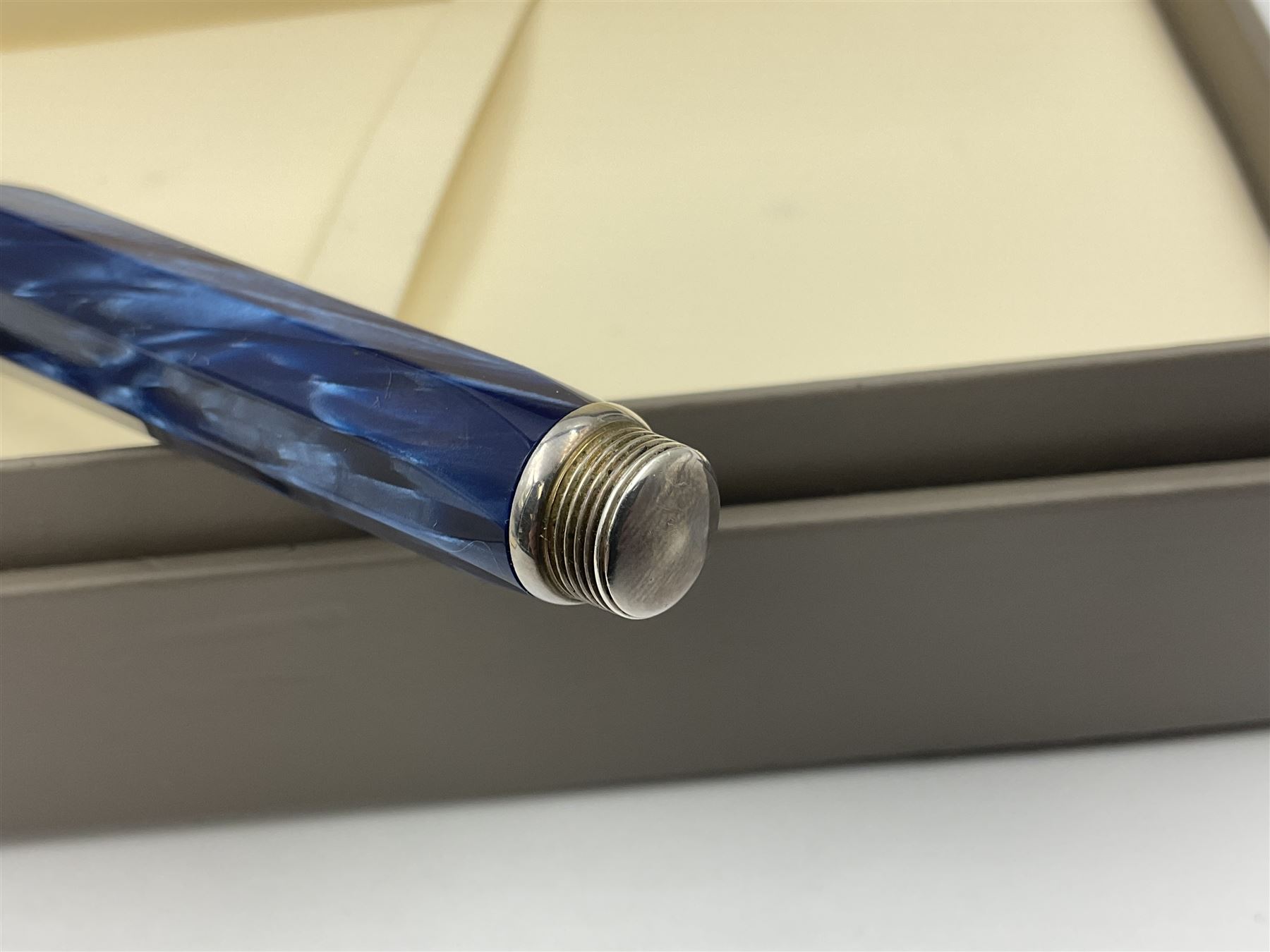 Montegrappa Emblema fountain pen, the blue pearl marbled barrel of octagonal form with silver mounts stamped 925 and silver mounted cap with 1912 emblem and clip with roller, in box, L13.5cm