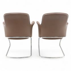 Two Senator executive cantilever chairs, upholstered in Padova hide, moulded back and integrated armrests, raised on a tubular chromed cantilever base