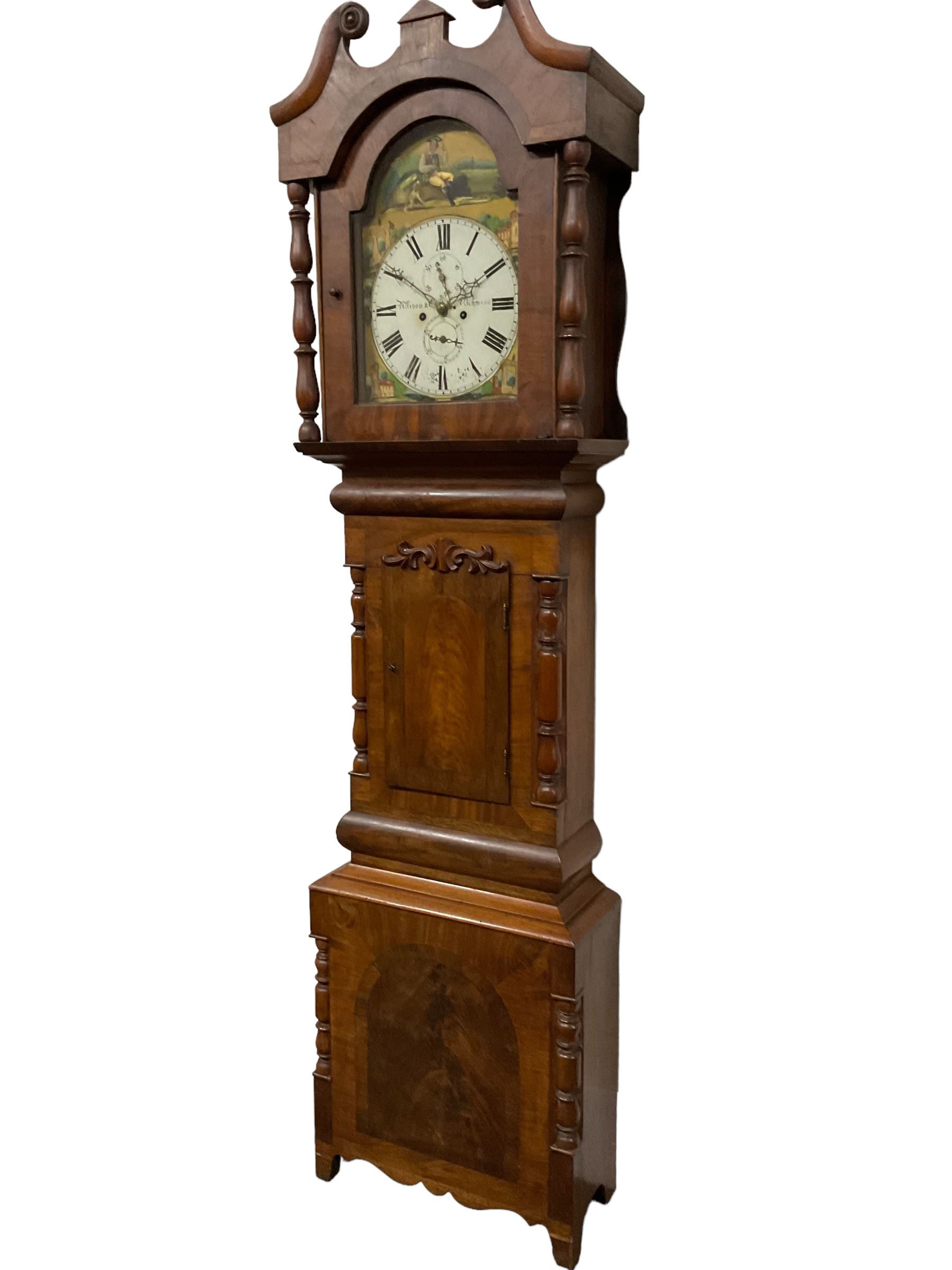 Francis Allison & Co. Finkle Street Richmond - late 19th century 8-day mahogany veneered longcase clock, with a swan’s neck pediment and break-arch hood door flanked by ring turned pillars, broad trunk with cushion moulding and recessed half-pillars to the sides, short trunk door with carved cresting to the top, rectangular plinth with conforming side pillars, fully painted 13” dial with matching brass hands, Roman numerals, minute track, subsidiary seconds and date dials, diagonally matched painted  spandrels and a depiction of a seated shepherd to the break arch, dial pinned directly to an eight-day rack striking movement, striking the hours on a bell. With weights and pendulum. 