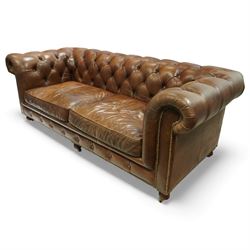 Timothy Oulton for Halo – tan leather three-seater Chesterfield sofa, fully deep-buttoned to the arms, back and seat, with studded front rail, rolled armrests and turned bun supports