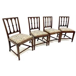 Set four Georgian mahogany dining chairs, carved rail back, drop in upholstered seat, square tapering supports 