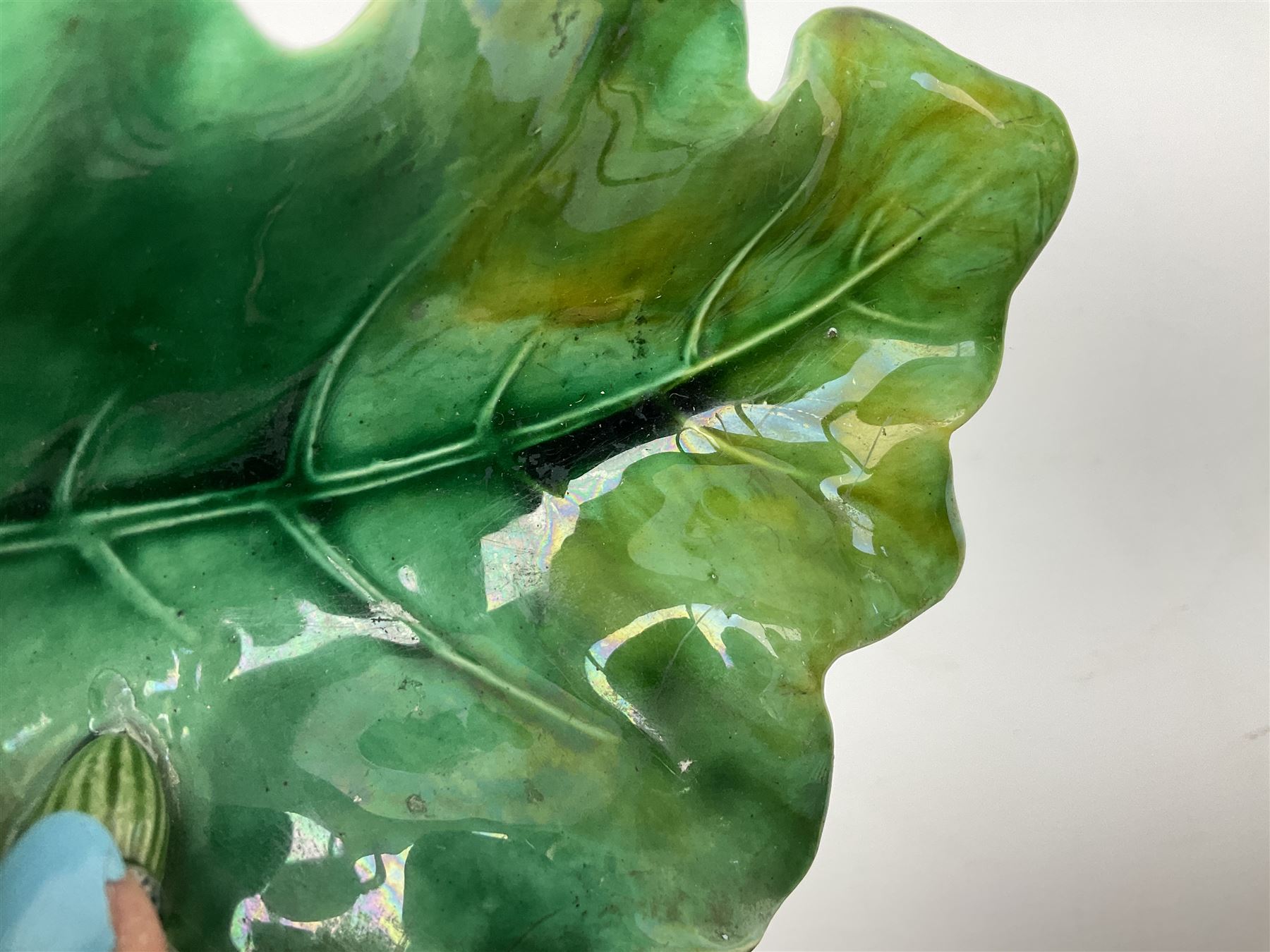 Minton majolica leaf dish, modelled as a Blue Tit perched on a branch with acorns and an oak leaf, date cypher for 1868, impressed marks beneath, L21cm. 