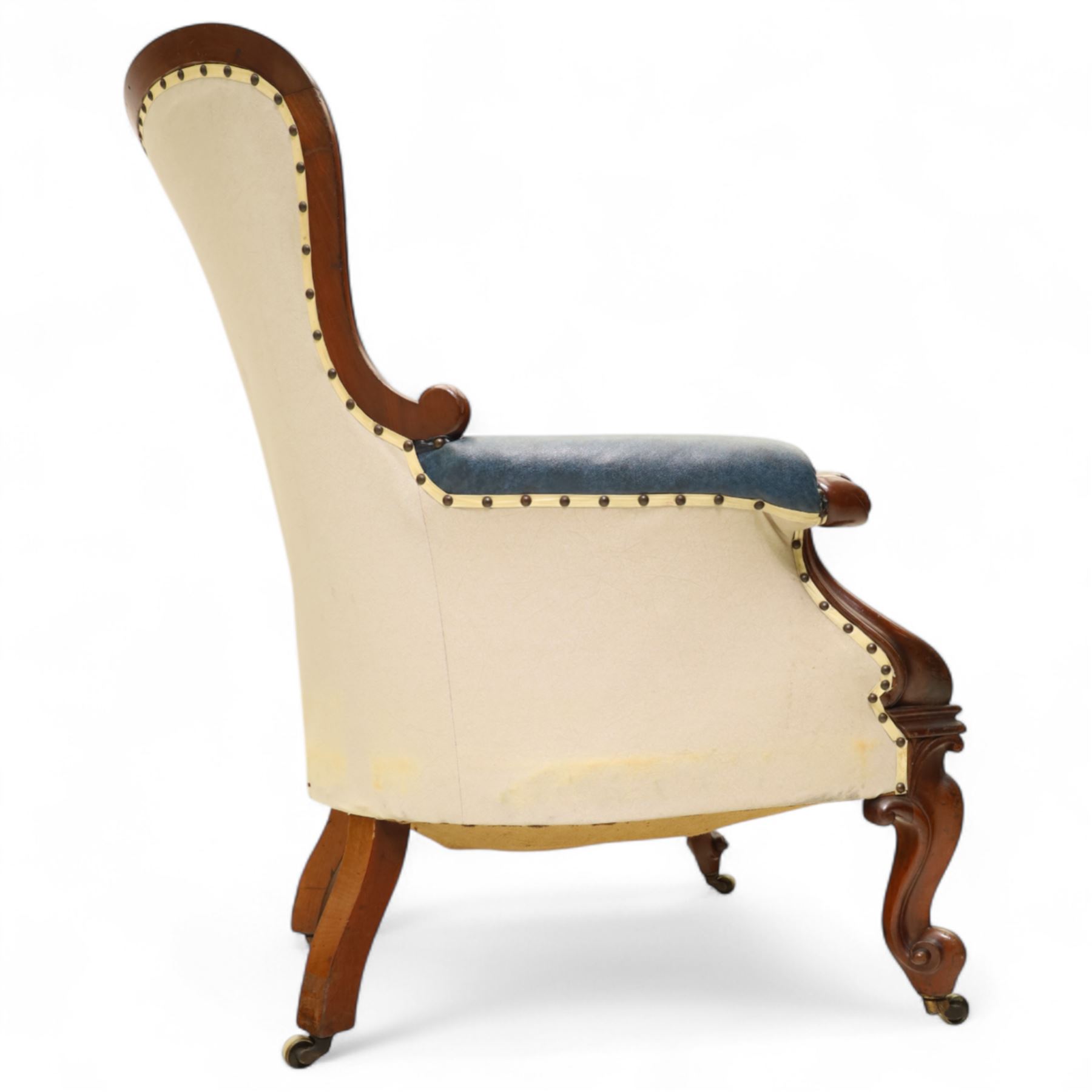 Fine pair of mid-19th-century mahogany library armchairs, carved frame with balloon-shaped back with scrolled ends, rolled wide arms, ending in a scrolled volute above a serpentine seat rail, upholstered in mottled turquoise faux leather, button upholstered back, arms, and cushion seat, studded sides and apron, raised on scroll carved front feet and splayed rear legs on castors 