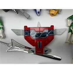 Collection of early 90s Mighty Morphin’ Power Rangers Zords, figures and accessories. Titanus the Carrier Zord, marked Bandai 1991; Green Dragonzord, incomplete; 1994 White Tigerzord with original instruction manual; 1993 Triceratops Dinozord, Mastodon Dinozord and Sabertooth Tiger Dinozord, Pterodactyl Dinozord, missing guns; with 1993 Power Morpher and original Power Coins, with further related figures, accessories and weapons