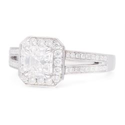 Platinum diamond cluster ring, the principal asscher cut diamond of 1.01 carat, with HRD report, colour F, clarity VS1, with round brilliant cut diamond surround and diamond set shoulders, hallmarked, total diamond weight 1.34 carat