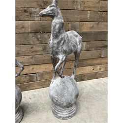 Pair of cast iron garden Stag figures or gate finials, raised on spherical ribbed base 