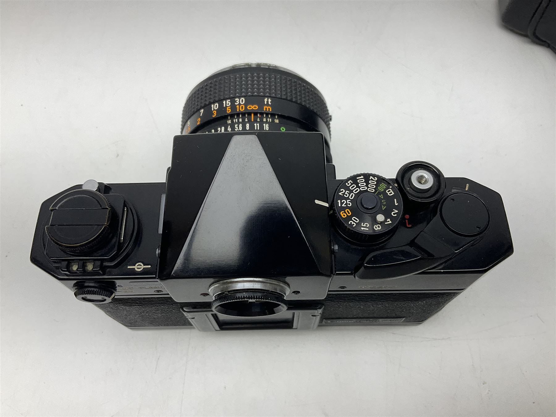 Canon F1n camera body, serial no. 572972, with 'Canon FD 50mm 1:1.4' lens, serial no. 246665, with leather case 