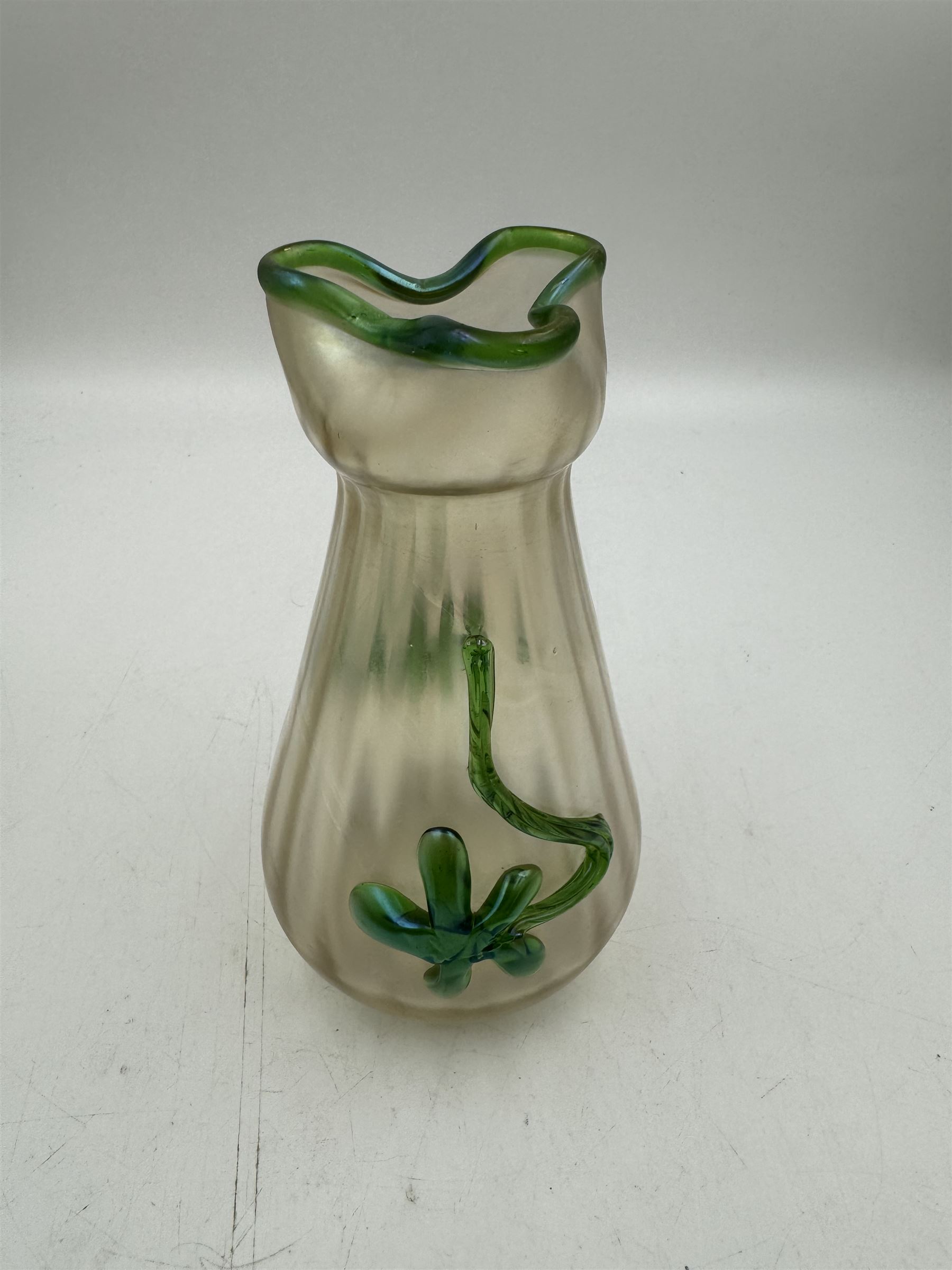 Three Austrian Art Nouveau iridescent glass vases, including a Kralik example of tapering form, with pearlescent lustre body and applied green flower decoration, tallest H18cm
