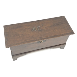  Small George lll planked oak coffer, hinged top with chip carved sides and brass nailed initials AE, on shaped bracket feet, W83cm, D32cm, H42cm  