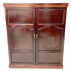 Chinese rosewood cocktail bar, hinge folding top, above two cupboard doors enclosing fitted interior, platform base